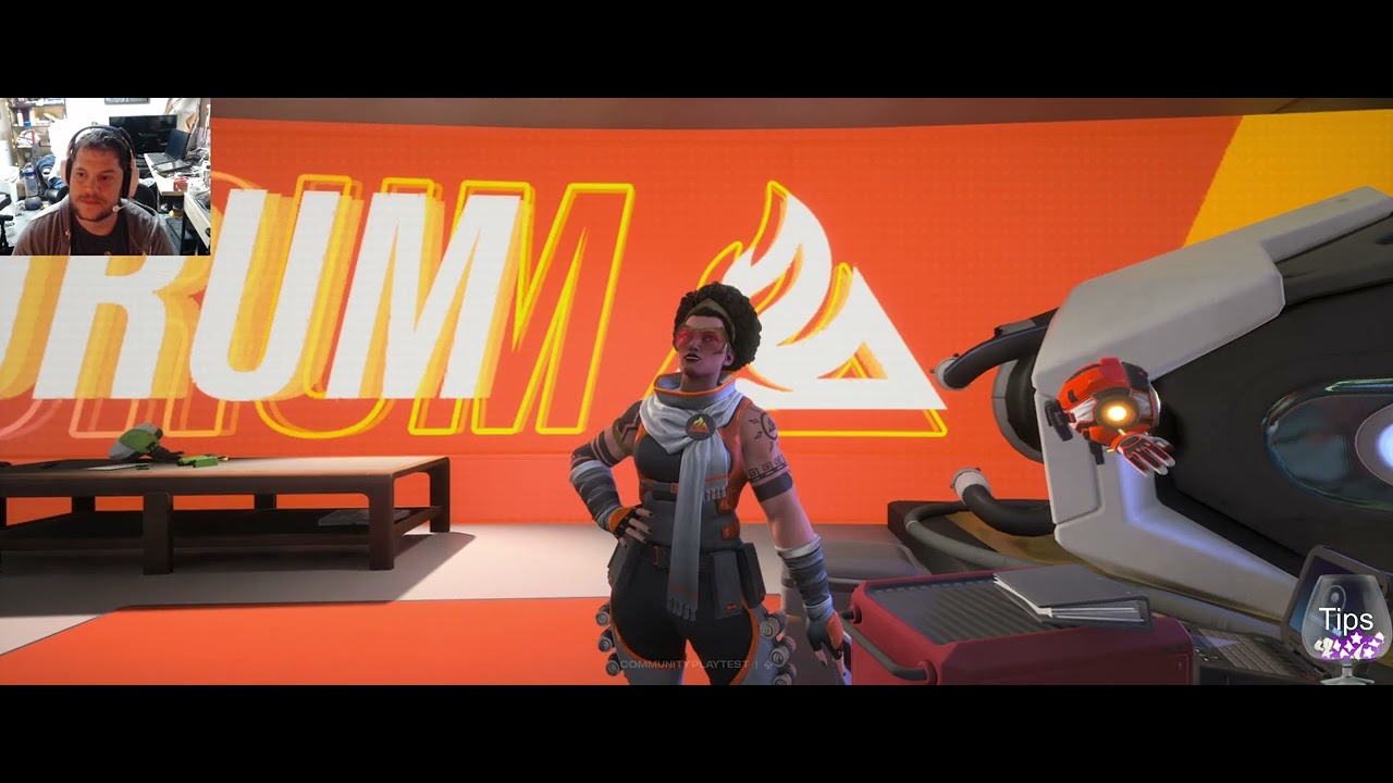 Sci-fi Project Ethos scene: a woman with an afro and sunglasses by an orange flame-logo banner and white pod